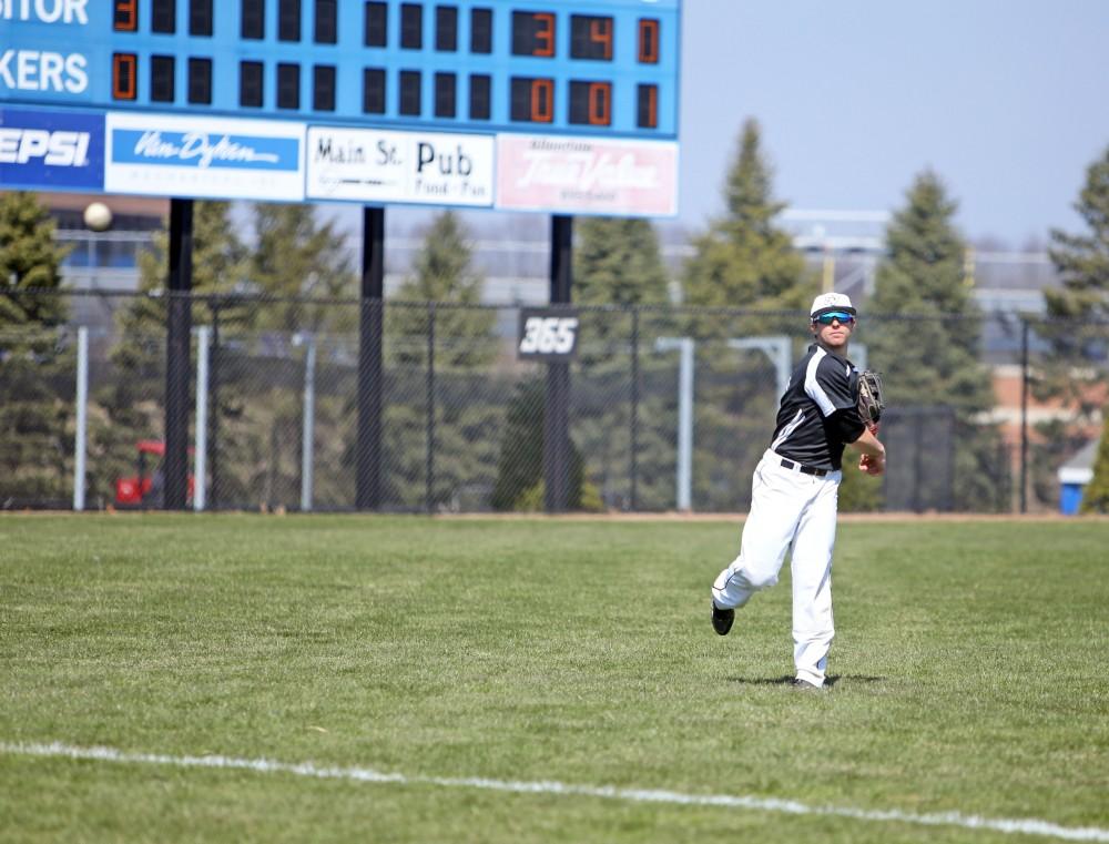 GVL / Emily Frye 
Outfielder Seth Johnson warms up before the start of the game against Saginaw Valley State University on Saturday Mar. 26, 2016. 