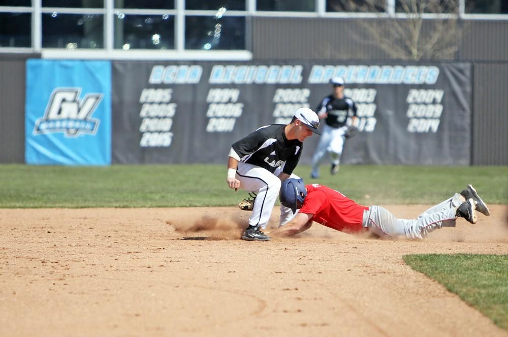 GVL / Emily Frye 
Infielder Josh Smith makes the tag at second base against Saginaw Valley State University on Saturday Mar. 26, 2016. 