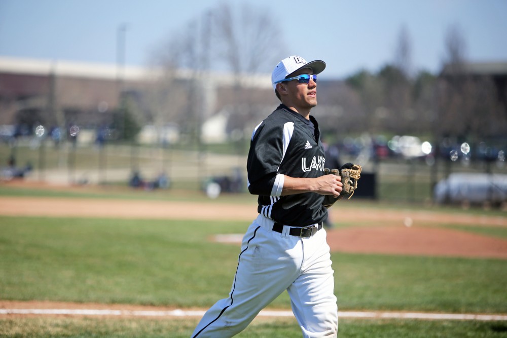 GVL / Emily Frye 
Junior Johnny Nate runs off the field between innings against Saginaw Valley State University on Saturday Mar. 26, 2016. 