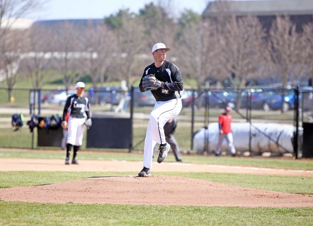 GVL / Emily Frye 
Senior Josh Griffith makes the first pitch against Saginaw Valley State University on Saturday Mar. 26, 2016. 