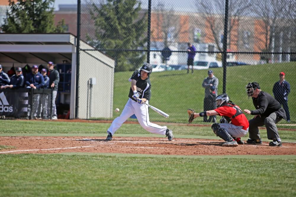 GVL / Emily Frye   
Senior Jason Ribecky makes a solid hit against Saginaw Valley State University on Saturday Mar. 26, 2016.