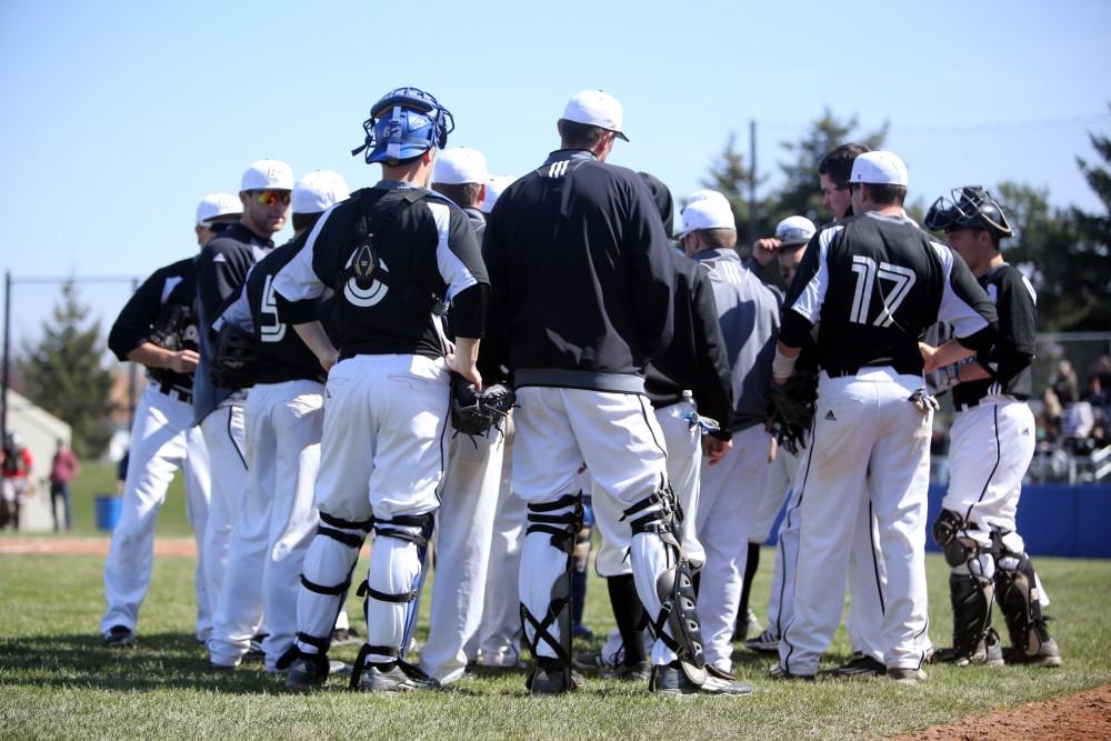 GVL / Emily Frye   
The Laker baseball team huddles after a rough inning against Saginaw Valley State University on Saturday Mar. 26, 2016.