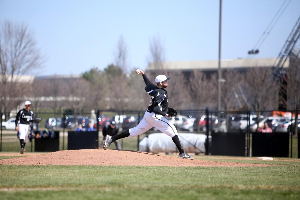 GVL / Emily Frye   
Senior Tim Tartar takes his place on the mound against Saginaw Valley State University on Saturday Mar. 26, 2016.