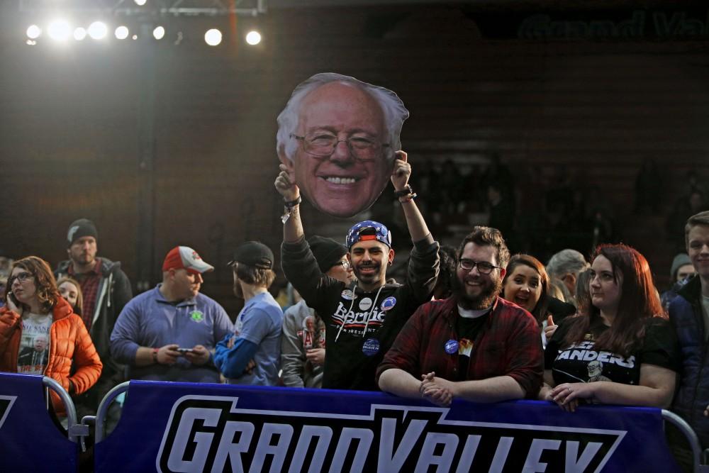 GVL / Emily Frye
Grand Valley State University student Jose Rodriguez prepares for Bernie Sanders arrival on Friday Mar. 4, 2016. Rodriguez has attended three Bernie Sanders rallies this far. 