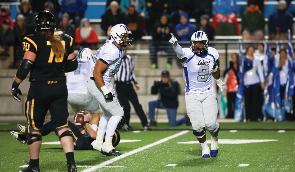 GVL / Kevin Sielaff - Matt Judon (9) hypes up his team after a sack. Grand Valley squares off against Michigan Tech Oct. 17 at Lubbers Stadium in Allendale. The Lakers defeated the Huskies with a score of 38-21.