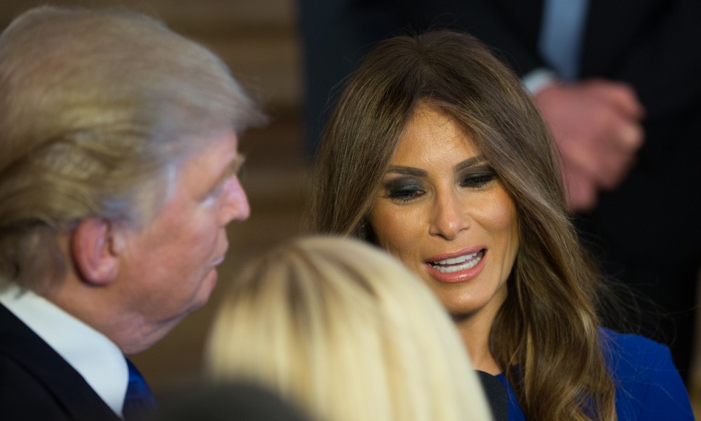 GVL / Kevin Sielaff - Donald Trump's wife, Melania Trump, speaks with a Fox News reporter. After the debate, candidates Donald Trump and John Kasich answer questions from the press at the entrance to the Fox Theater in Detroit, MI on Friday, March 4, 2016.