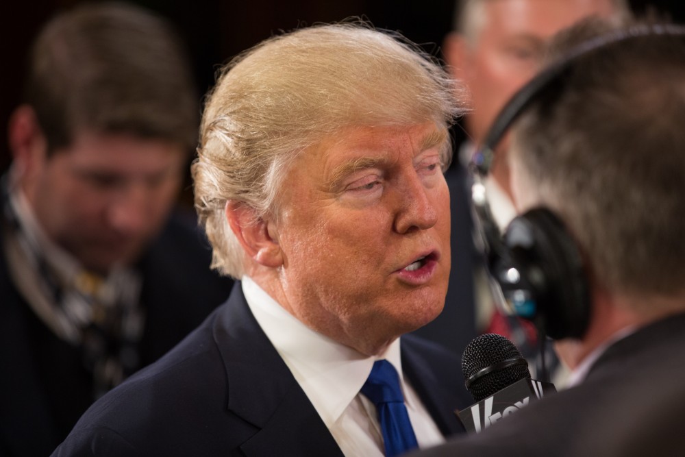 GVL / Kevin Sielaff - After the debate, Republican hopeful Donald Trump answers questions from the press at the entrance to the Fox Theater in Detroit, MI on Friday, March 4, 2016.