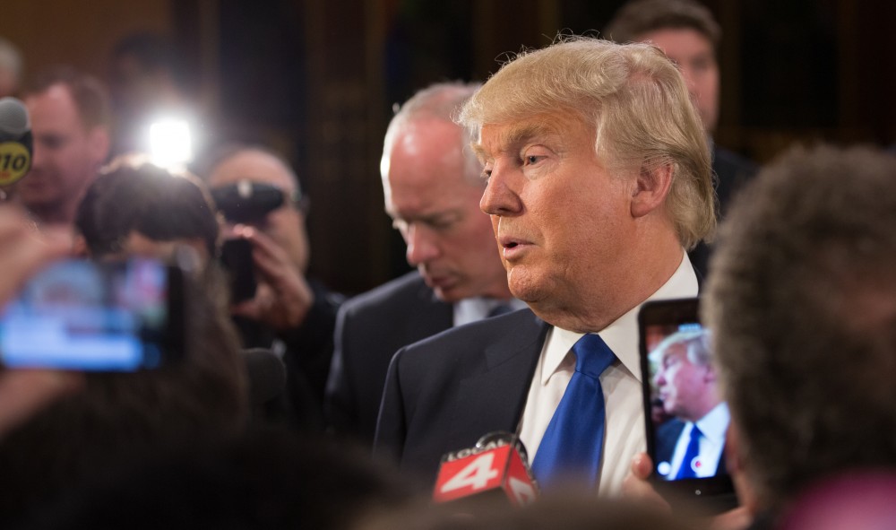 GVL / Kevin Sielaff - After the debate, Republican hopeful Donald Trump answers questions from the press at the entrance to the Fox Theater in Detroit, MI on Friday, March 4, 2016.