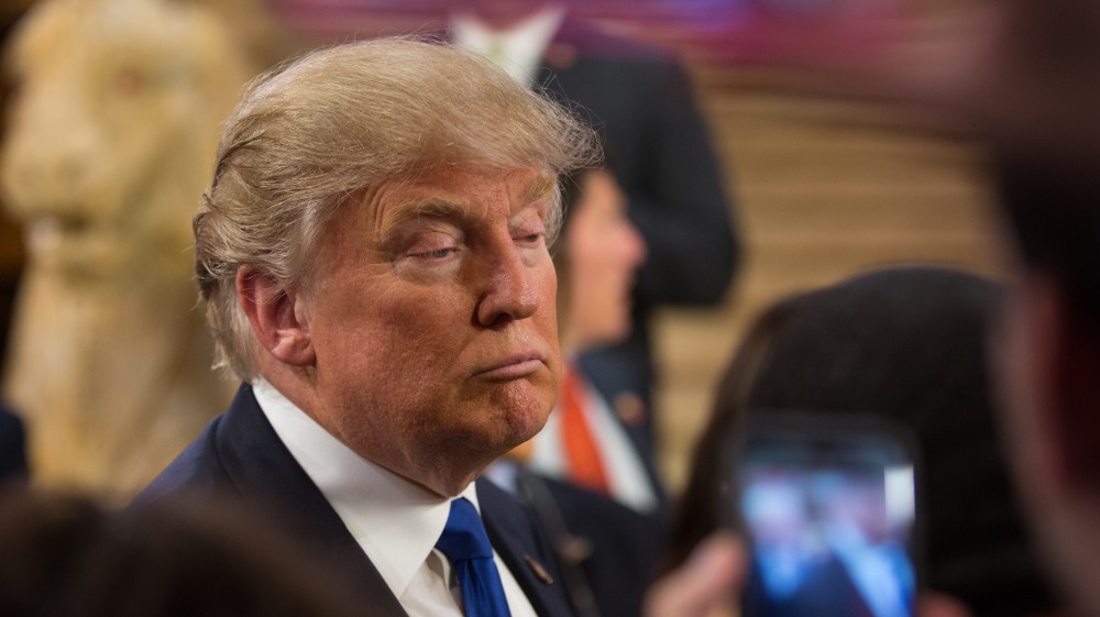 GVL / Kevin Sielaff - After the debate, Republican hopeful Donald Trump answers questions from the press at the entrance to the Fox Theater in Detroit, MI on Friday, March 4, 2016.