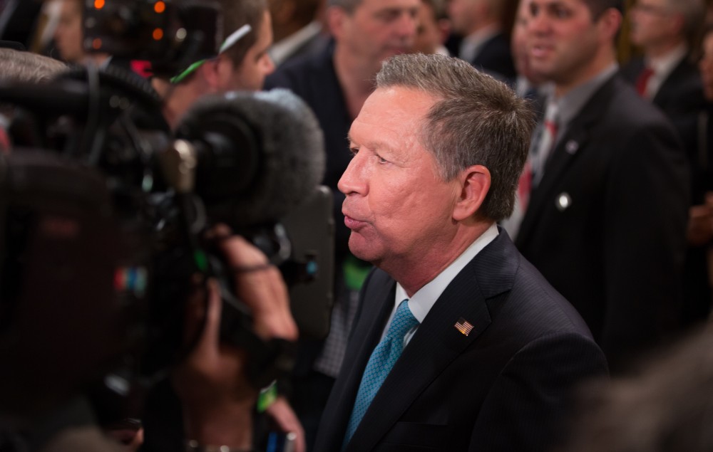 GVL / Kevin Sielaff - After the debate, Republican hopeful John Kasich answers questions from the press at the entrance to the Fox Theater in Detroit, MI on Friday, March 4, 2016.