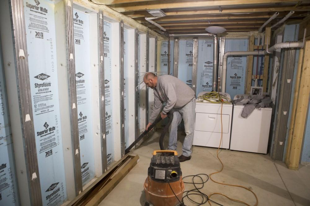 GVL / Sara Carte - Grand Valley alumni, Steve Peterson, volunteers for Kent County Habitat for Humanity in Grand Rapids on Thursday, Mar. 24, 2016.