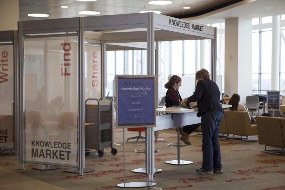 GVL / Sara Carte - Studentscome to the Knowledge Market in the Mary Idema Pew Library on Allendale’s campus on Monday, Mar. 14, 2016.