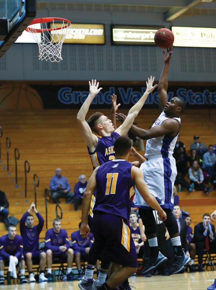 GVL / Kevin Sielaff - Trevin Alexander (5) tries a floater and elevates above the defense.  The Lakers fall to the Eagles of Ashland University in a tough overtime loss Dec. 3 in Allendale. The final score was 76-72.