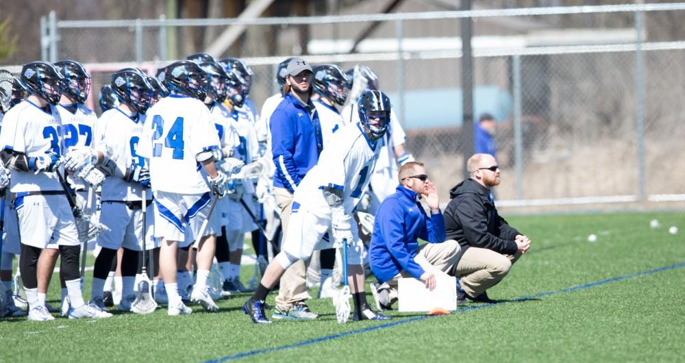 GVL / Kevin Sielaff – The Lakers and head coach Tim Murray watch the game from the sideline. Grand Valley’s men’s lacrosse team squares off against Siena Heights University Sunday, March 20, 2016 in Allendale.