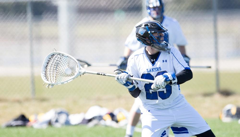 GVL / Kevin Sielaff – Goaltender Kyrn Stoddard (23) launches a pass up field. Grand Valley’s men’s lacrosse team squares off against Siena Heights University Sunday, March 20, 2016 in Allendale.