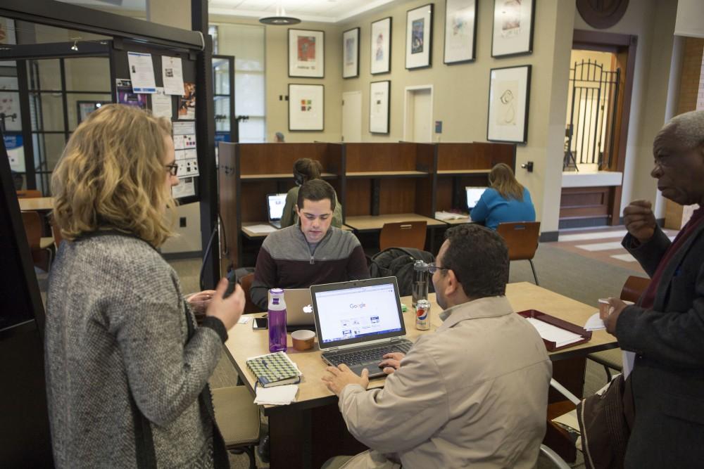 GVL / Sara Carte - The Kaufman Interfaith Institute Program Manager, Katie Gordon and Andrew Plague, speak with students and staff at the Religius & Spiritual Identity Listening Sessions in the DeVos Campus on Wednesday, Mar. 23, 2016.