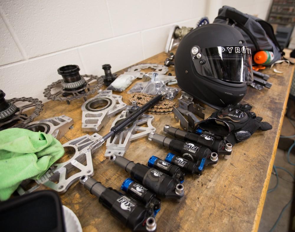 GVL / Kevin Sielaff – Members of Grand Valley’s Formula SAE Racing Team preps the engine to be mounted on the frame of the vehicle inside of the Eberhard Center’s engineering labs Thursday, March 17, 2016.