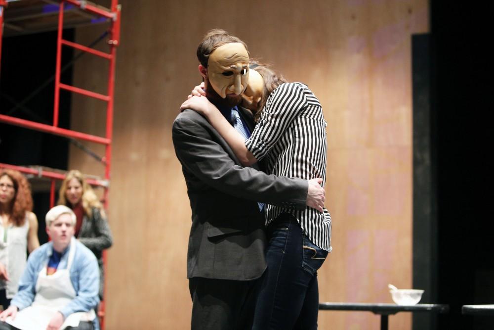 GVL / Emily Frye 
Justin Mackey and Charlie Wilburn, from the upcoming play "Six Characters Theater Performance", share an embrass during a rehearsal scene on Thursday Mar. 24, 2016. 