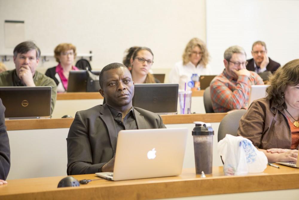 GVL / Sara Carte - Grand Valley faculty, Felix Ngassa, speaks at the UAS meeting in the DeVos Campus on Friday, Mar. 25, 2016.