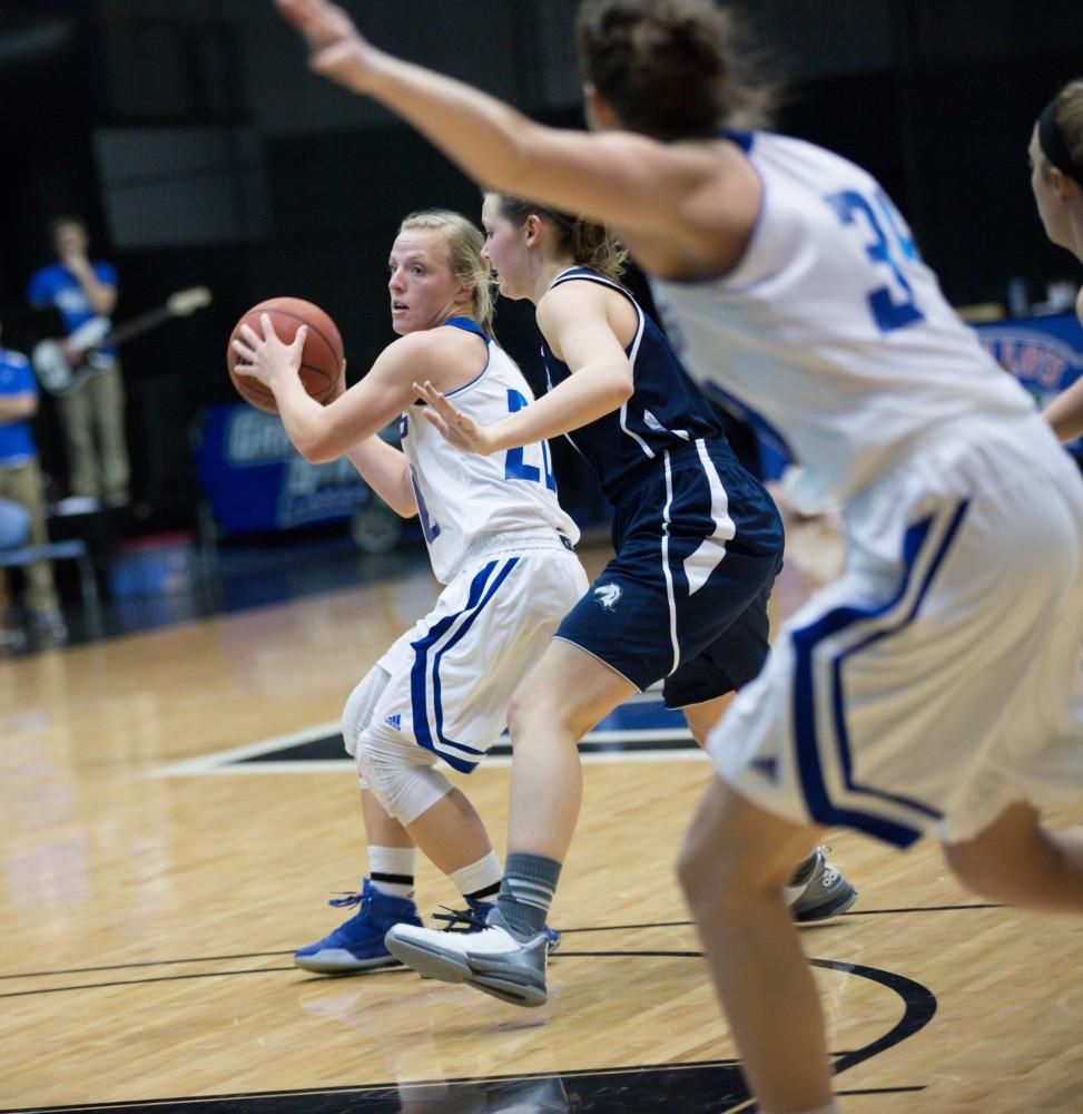 GVL / Kevin Sielaff - Janae Langs (20) picks up her dribbles and looks to pass the ball.  The Lakers defeat the Chargers of Hillsdale College Saturday, Jan. 30, 2016 in Allendale.