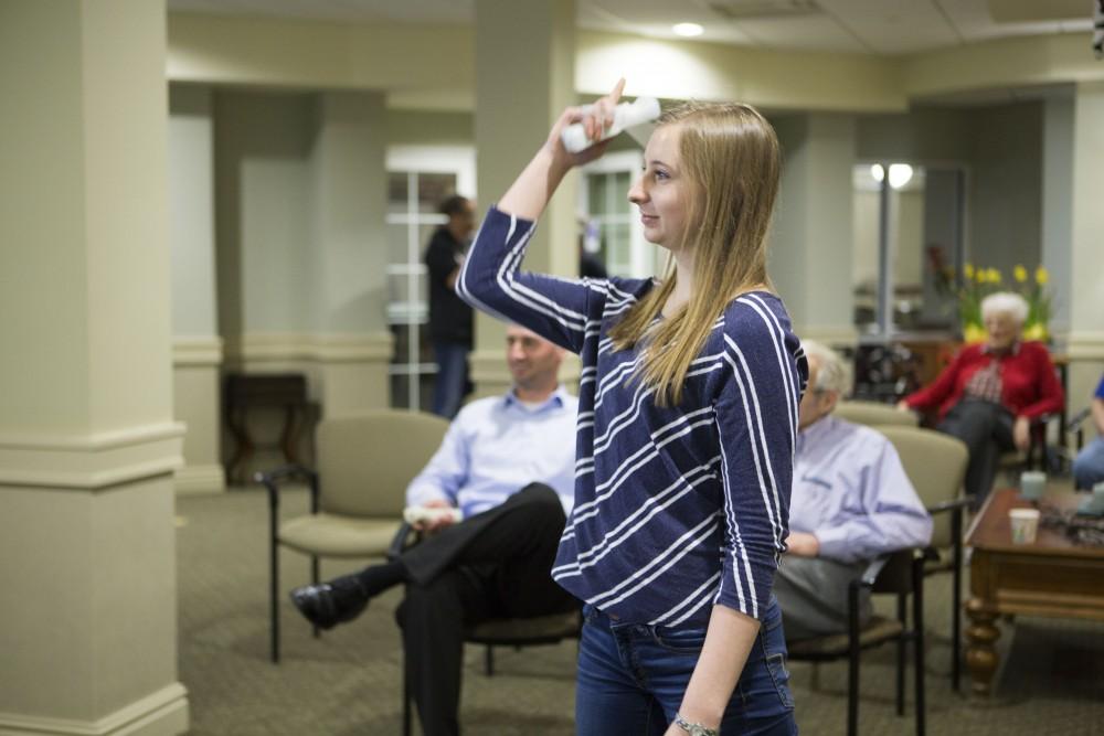 GVL / Sara Carte - Volunteer, Melissa Strauss, plays in the wii bowling tournament for Community Outreach Week at the Covenant Village of the Great Lakes on Thursday, Mar. 24, 2016.