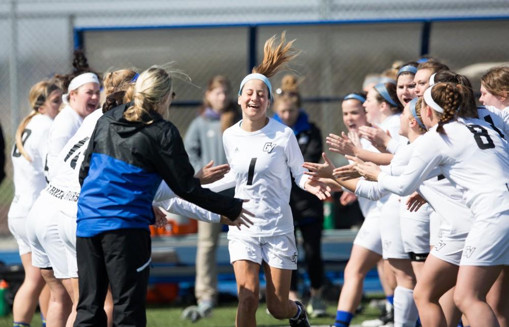 GVL / Kevin Sielaff – Ryan Skomial (1) runs onto the field as the starting line-up is announced. The Lakers defeat the Greyhounds of the University of Indianapolis Saturday, March 26, 2016 with a final score of 15-4.