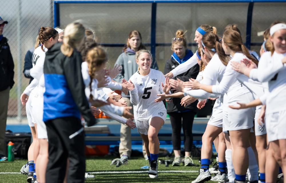 GVL / Kevin Sielaff – Kelly Leibovitz (5) runs onto the field as the starting line-up is announced. The Lakers defeat the Greyhounds of the University of Indianapolis Saturday, March 26, 2016 with a final score of 15-4.