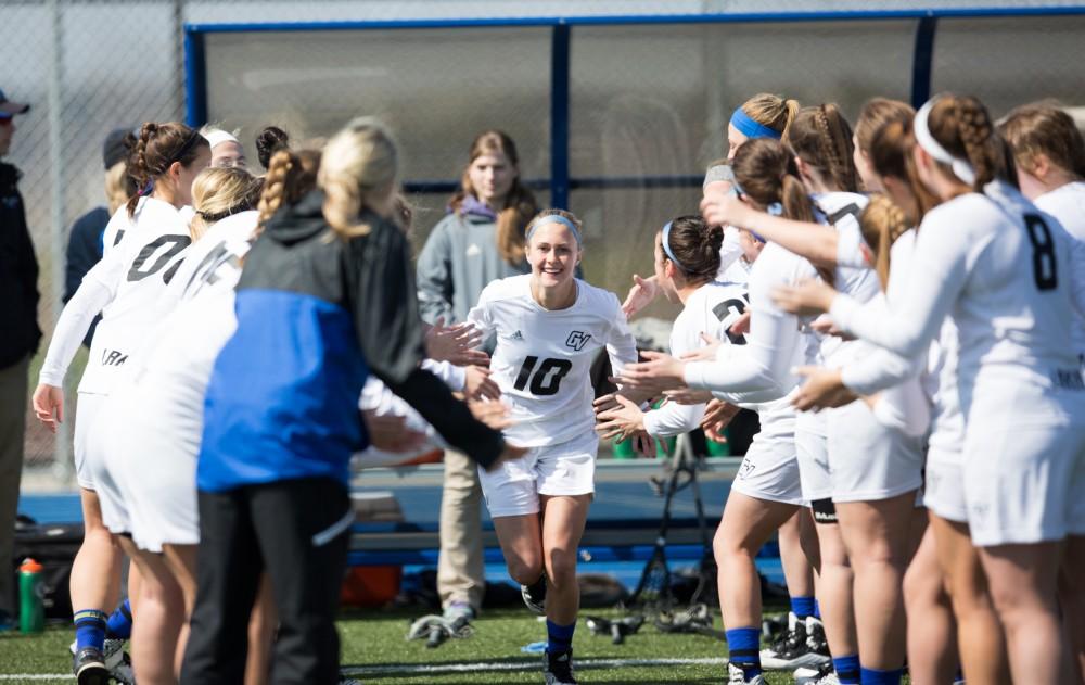 GVL / Kevin Sielaff – Chelsey Bishop (10) runs onto the field as the starting line-up is announced. The Lakers defeat the Greyhounds of the University of Indianapolis Saturday, March 26, 2016 with a final score of 15-4.