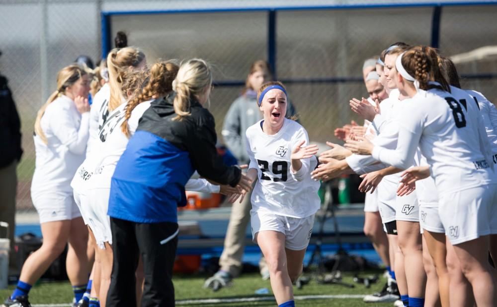 GVL / Kevin Sielaff – Adrianna Smith (29) runs onto the field as the starting line-up is announced. The Lakers defeat the Greyhounds of the University of Indianapolis Saturday, March 26, 2016 with a final score of 15-4.