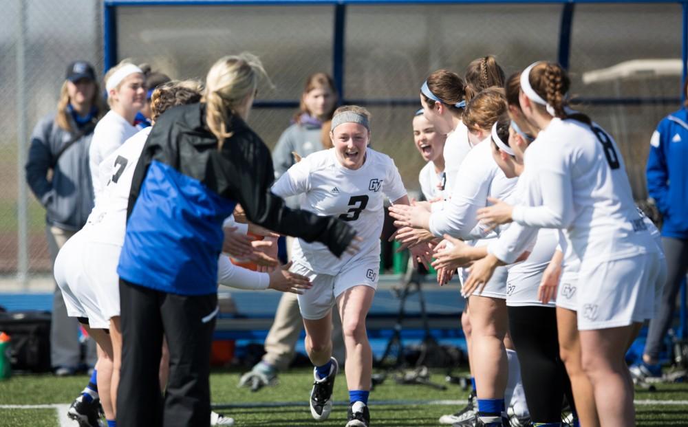 GVL / Kevin Sielaff – Erika Neumen (3) runs onto the field as the starting line-up is announced. The Lakers defeat the Greyhounds of the University of Indianapolis Saturday, March 26, 2016 with a final score of 15-4.