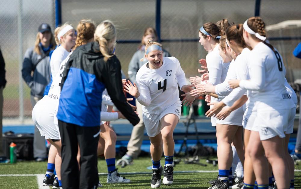 GVL / Kevin Sielaff – Kira Dosenberry (4) runs onto the field as the starting line-up is announced. The Lakers defeat the Greyhounds of the University of Indianapolis Saturday, March 26, 2016 with a final score of 15-4.