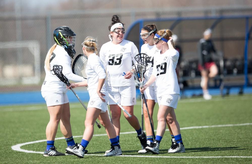 GVL / Kevin Sielaff – Caitlin Wojichowski (33) and company return to Grand Valley's zone to celebrate a goal. The Lakers defeat the Greyhounds of the University of Indianapolis Saturday, March 26, 2016 with a final score of 15-4.