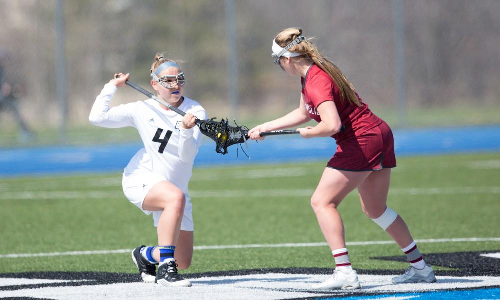 GVL / Kevin Sielaff – Kira Dosenberry (4) takes a face-off at mid-field. The Lakers defeat the Greyhounds of the University of Indianapolis Saturday, March 26, 2016 with a final score of 15-4.