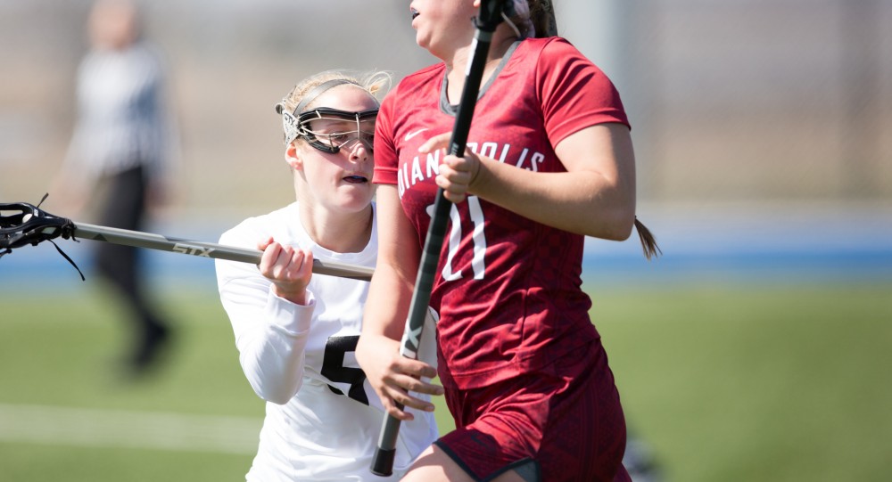 GVL / Kevin Sielaff – Kelly Leibovitz (5) defends Sydney Hauffman (21) of Indianapolis. The Lakers defeat the Greyhounds of the University of Indianapolis Saturday, March 26, 2016 with a final score of 15-4.