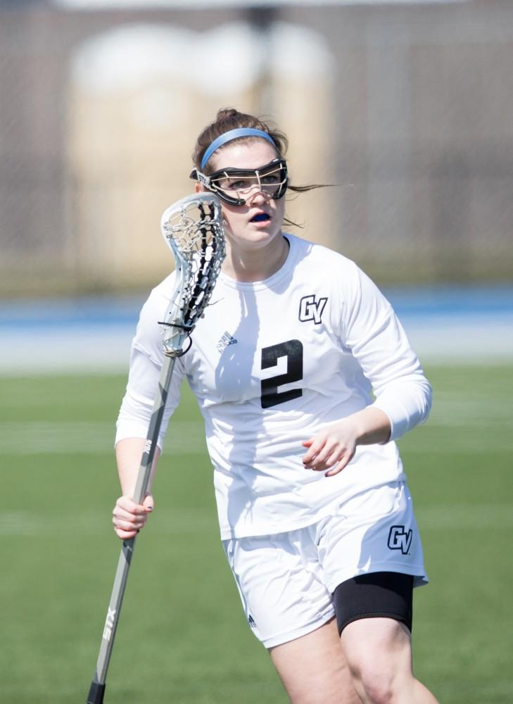 GVL / Kevin Sielaff – Elizabeth Grisko (2) runs back toward Grand Valley's zone as the play moves down field. The Lakers defeat the Greyhounds of the University of Indianapolis Saturday, March 26, 2016 with a final score of 15-4.