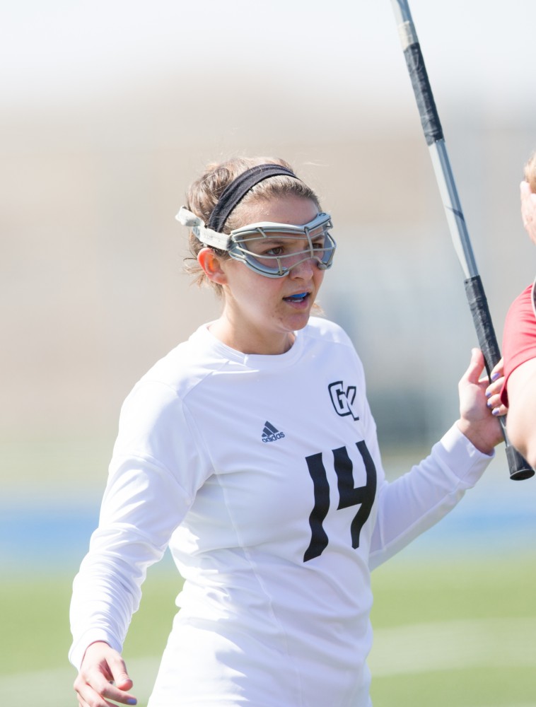 GVL / Kevin Sielaff – Chloe Zdybel (14) waits for the play to pick up and prepares to defend Grand Valley's zone. The Lakers defeat the Greyhounds of the University of Indianapolis Saturday, March 26, 2016 with a final score of 15-4.