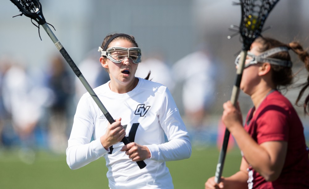 GVL / Kevin Sielaff – Chloe Zdybel (14) defends Grand Valley's zone. The Lakers defeat the Greyhounds of the University of Indianapolis Saturday, March 26, 2016 with a final score of 15-4.