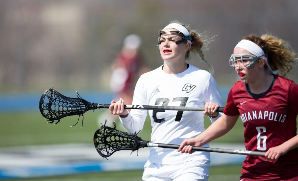 GVL / Kevin Sielaff – Danielle Tunnell (27) stands in front of Indianapolis' net and waits for the play to pick up. The Lakers defeat the Greyhounds of the University of Indianapolis Saturday, March 26, 2016 with a final score of 15-4.