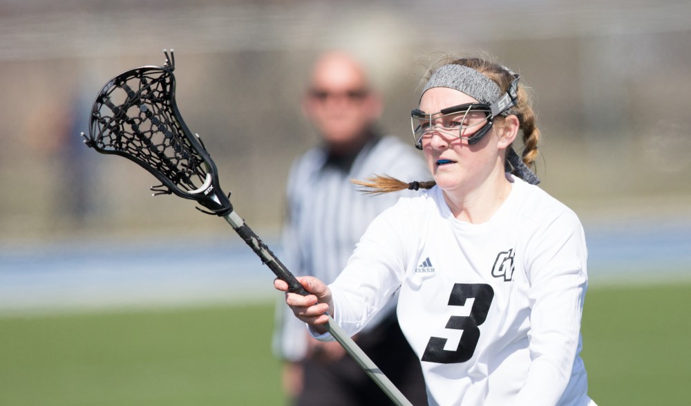 GVL / Kevin Sielaff – Erika Neumen (3) passes the ball off in front of Indianapolis' net. The Lakers defeat the Greyhounds of the University of Indianapolis Saturday, March 26, 2016 with a final score of 15-4.