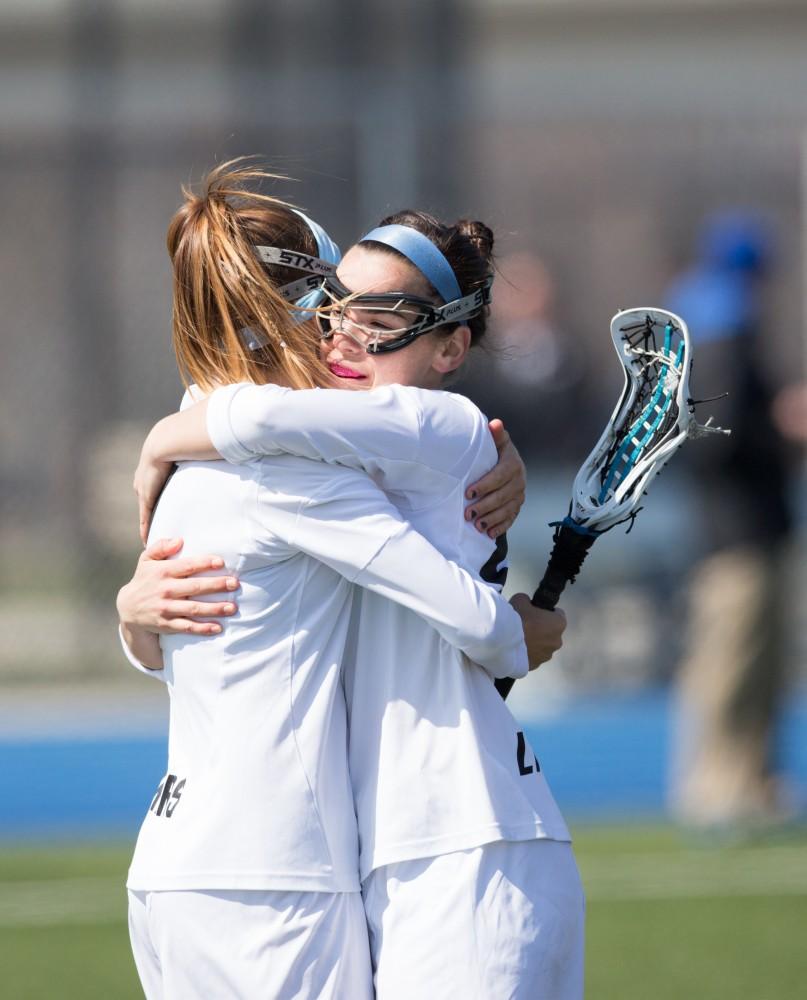 GVL / Kevin Sielaff – Carolyn Kraus (23) and Ryan Skomial (1) celebrate a goal. The Lakers defeat the Greyhounds of the University of Indianapolis Saturday, March 26, 2016 with a final score of 15-4.