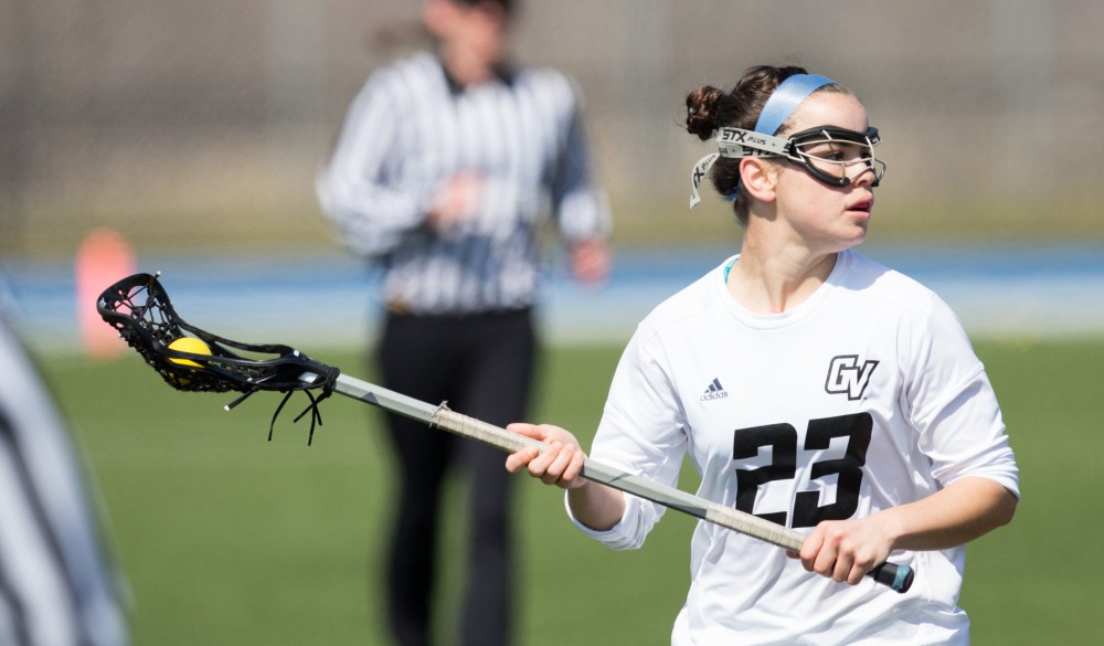 GVL / Kevin Sielaff – Carolyn Kraus (23) looks to set up a play in front of Indianapolis' net. The Lakers defeat the Greyhounds of the University of Indianapolis Saturday, March 26, 2016 with a final score of 15-4.