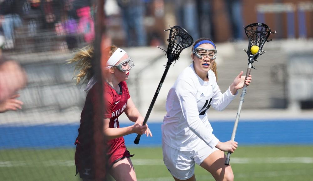 GVL / Kevin Sielaff – Meggan Loyd (15) gets around the Indianapolis defense and moves in on net. The Lakers defeat the Greyhounds of the University of Indianapolis Saturday, March 26, 2016 with a final score of 15-4.