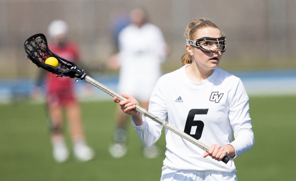 GVL / Kevin Sielaff – Ashley Bailey (6) holds the ball in the offensive zone. The Lakers defeat the Greyhounds of the University of Indianapolis Saturday, March 26, 2016 with a final score of 15-4.