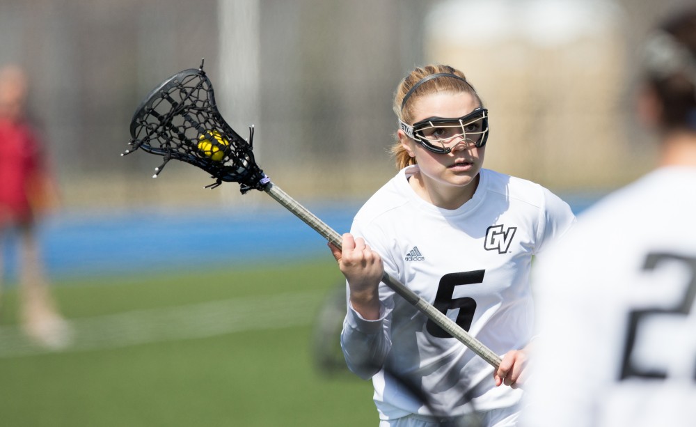 GVL / Kevin Sielaff – Ashley Bailey (6) moves the ball in the offensive zone. The Lakers defeat the Greyhounds of the University of Indianapolis Saturday, March 26, 2016 with a final score of 15-4.