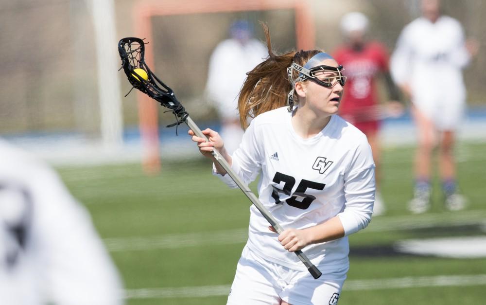 GVL / Kevin Sielaff – Carlyn Shisler (25) moves the ball in the offensive zone. The Lakers defeat the Greyhounds of the University of Indianapolis Saturday, March 26, 2016 with a final score of 15-4.