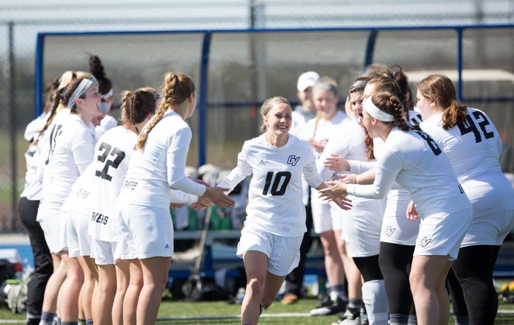 GVL / Kevin Sielaff – Chelsey Bishop (10) runs onto the field as the starting line-up is called. The Lakers defeat the Bearcats of McKendree University with a final score of 23-11 Friday, March 25, 2016 in Allendale.