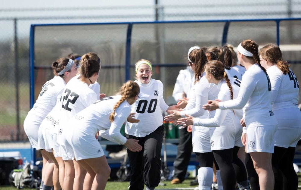 GVL / Kevin Sielaff – Sarah Zwilsky (00) runs onto the field as the starting line-up is called. The Lakers defeat the Bearcats of McKendree University with a final score of 23-11 Friday, March 25, 2016 in Allendale.