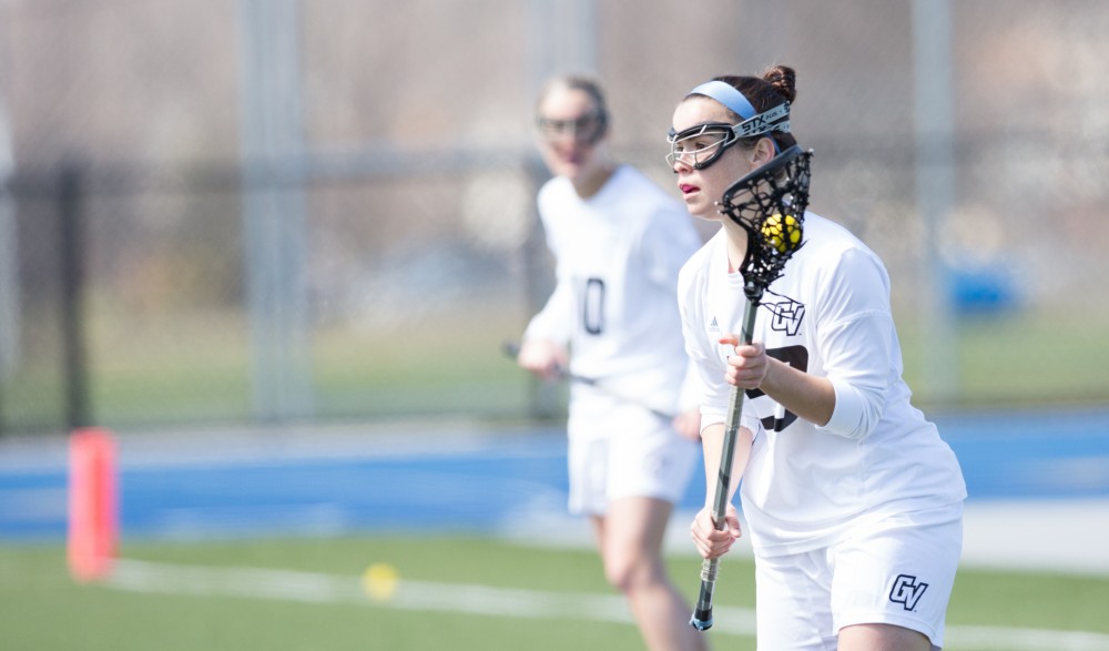 GVL / Kevin Sielaff – Carolyn Kraus (23) passes the ball around in McKendree's zone. The Lakers defeat the Bearcats of McKendree University with a final score of 23-11 Friday, March 25, 2016 in Allendale.