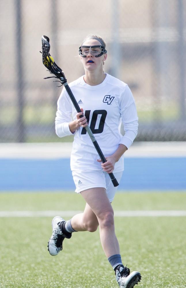 GVL / Kevin Sielaff – Chelsey Bishop (10) moves the ball around McKendree's zone. The Lakers defeat the Bearcats of McKendree University with a final score of 23-11 Friday, March 25, 2016 in Allendale.