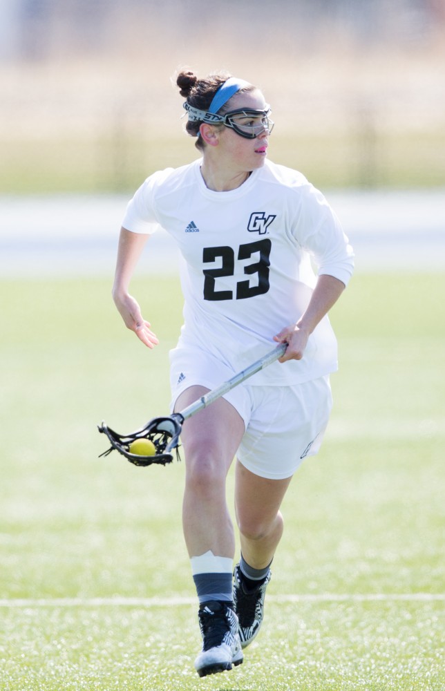 GVL / Kevin Sielaff – Carolyn Kraus (23) moves the ball up field. The Lakers defeat the Bearcats of McKendree University with a final score of 23-11 Friday, March 25, 2016 in Allendale.